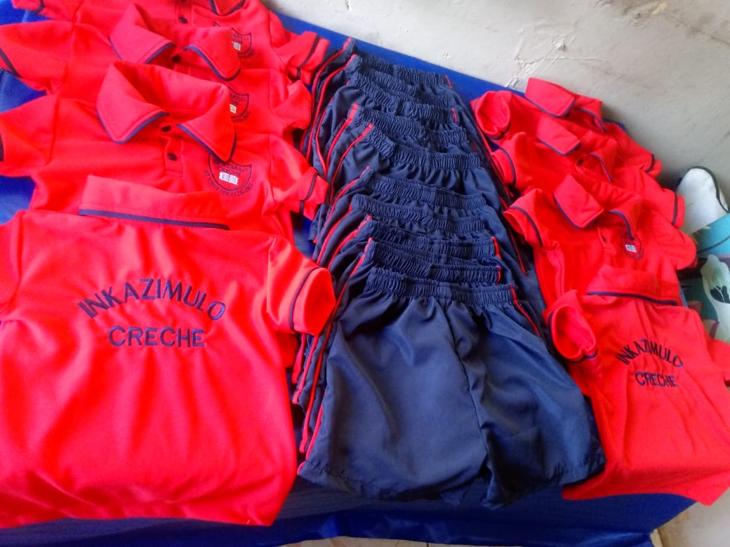 Red and navy Inkazimulo Creche uniforms